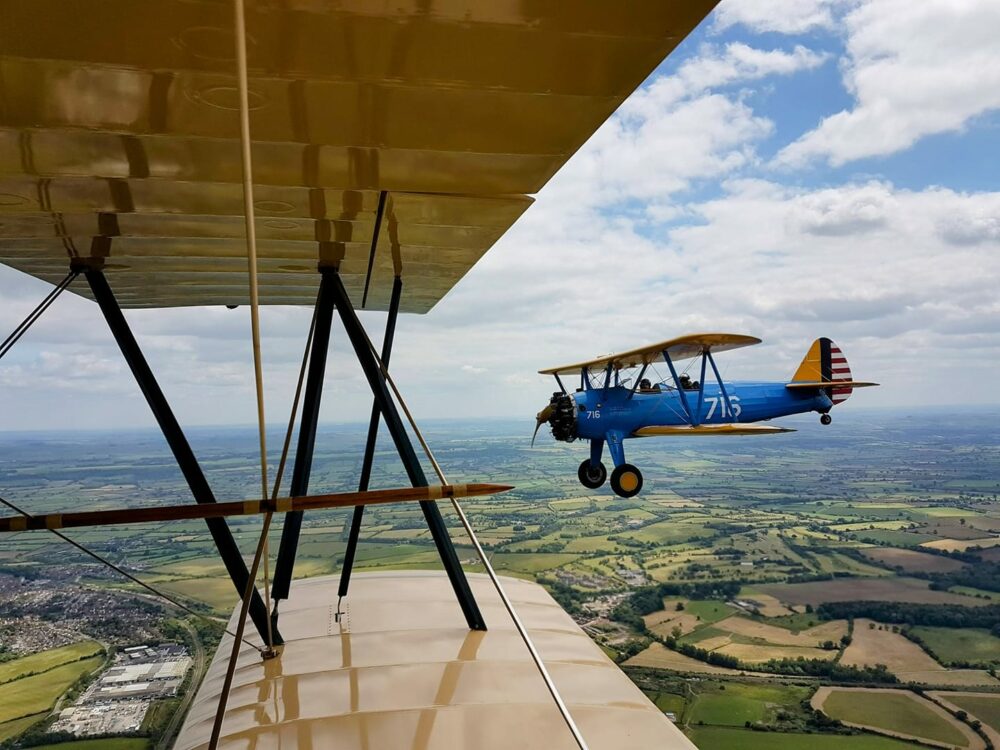 Sean McRandle – Flying in a 1926 Travelair with a Stearman as wingman.