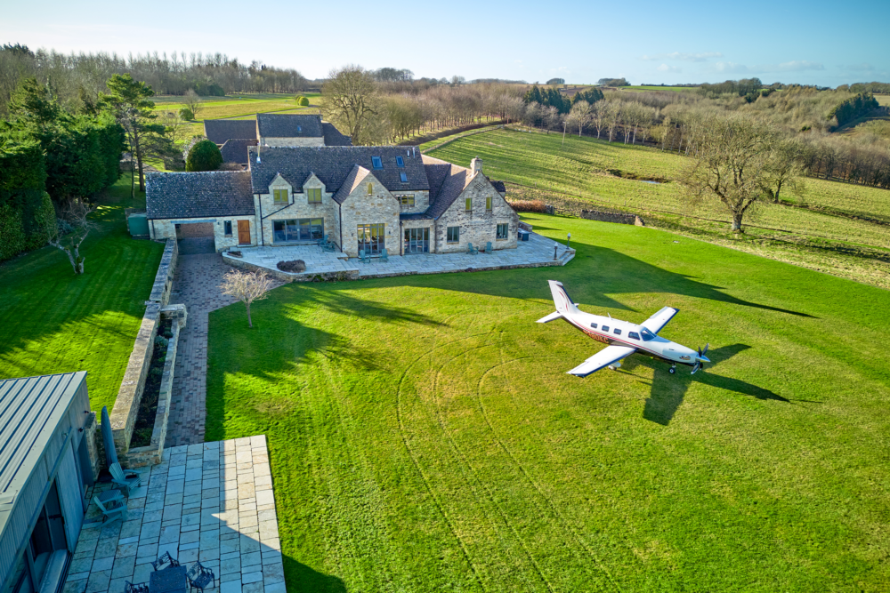 Aircraft in front of house