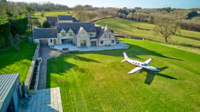 Aircraft in front of house