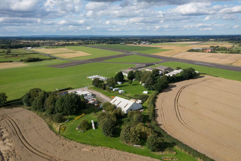 The house and hangar for sale are in the foreground with former WWII base Rufforth Airfield behind. Photos: Wishart Estate Agents