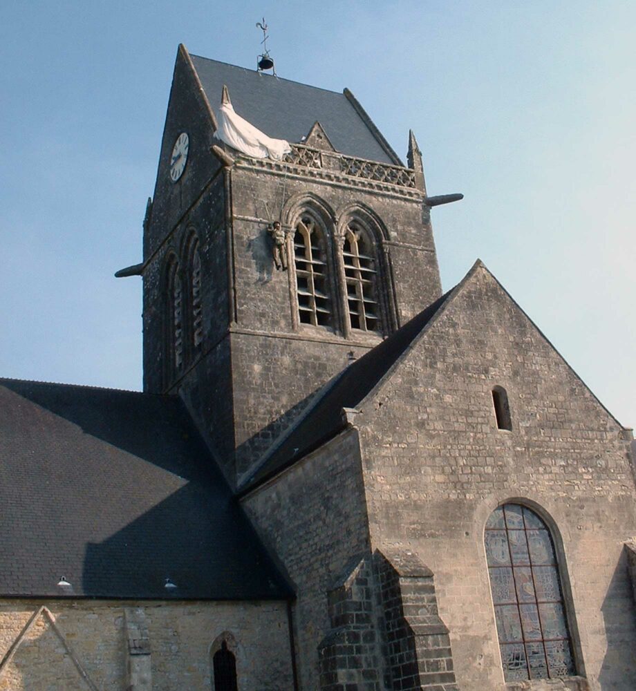 St. Mère-Église with 'Private John Steele' hanging from the spire. Photo: Wiggy Too