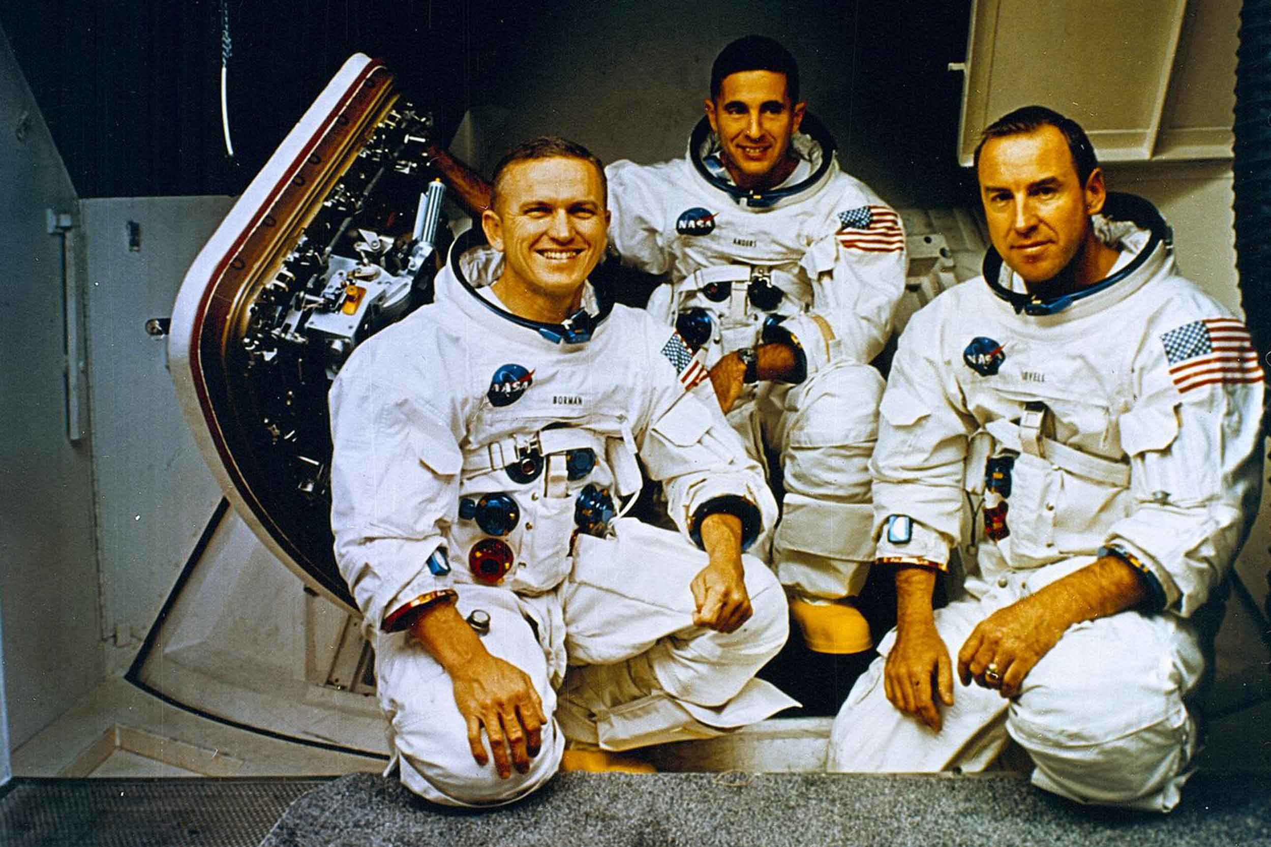 The Apollo 8 Crew (L to R) Frank Borman, commander; William Anders, Lunar Module (LM) Pilot; and James Lovell, Command Module (CM) pilot pose in front of the Apollo mission simulator during training. The three served as the crew for the first manned Apollo mission launched aboard the Saturn V and first manned Apollo craft to enter lunar orbit. Photo: NASA