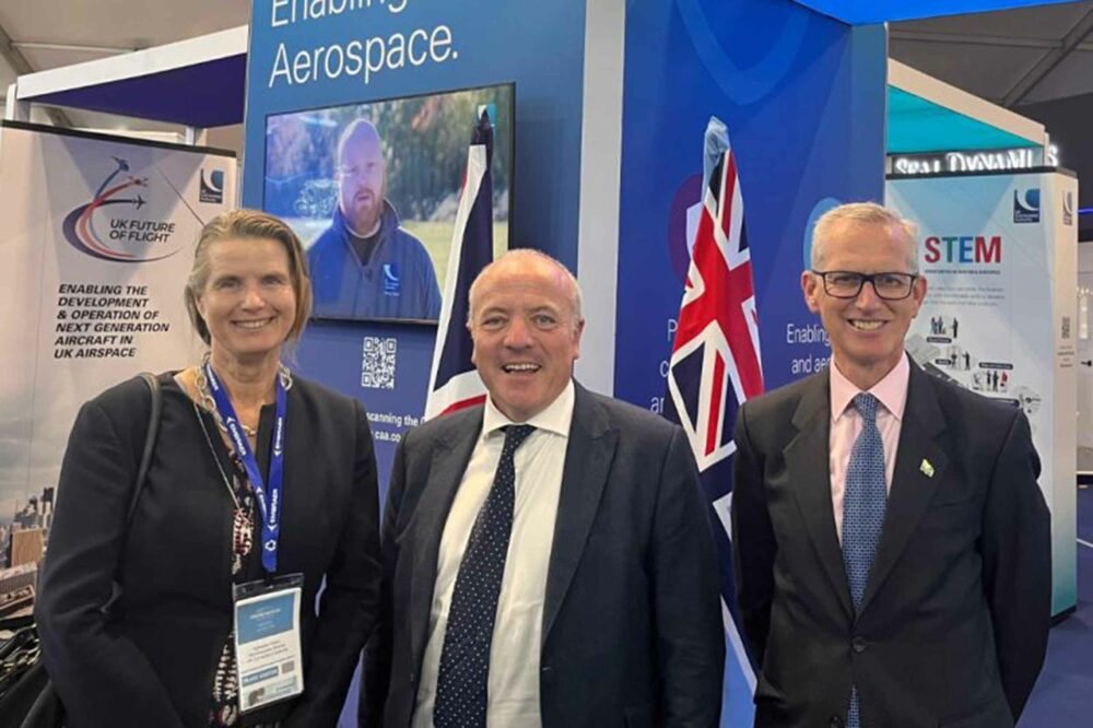 Aviation Minister Mike Kane, centre, with the CAA's Katherine Corich and Sir Stephen Hillier