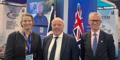 Aviation Minister Mike Kane, centre, with the CAA's Katherine Corich and Sir Stephen Hillier