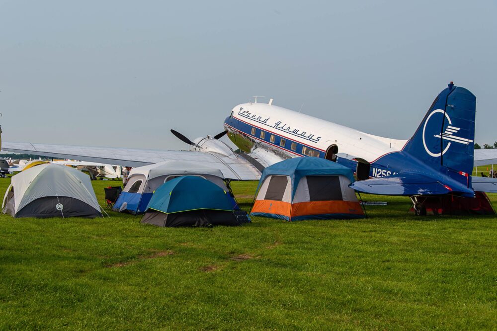 Tents alongside a DC-3 at EAA AirVenture