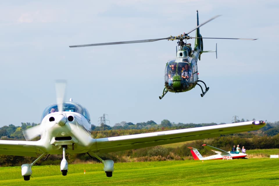 Gazelle G-BZYD leaving the Kittyhawk Fly in, with Sting S4 G-DBSB.