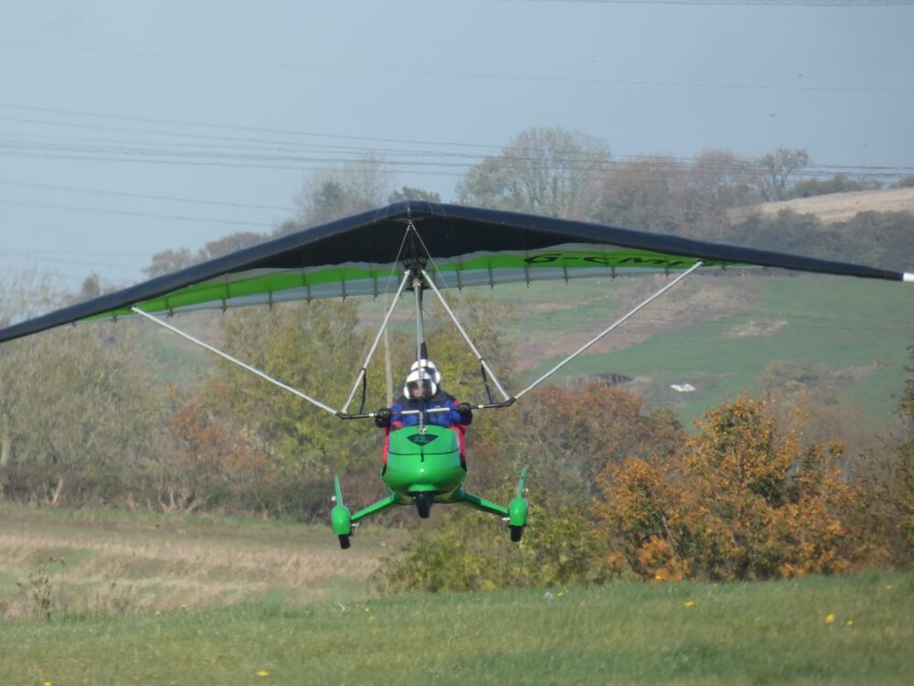 Neil Douglas taking off from Over Farm in his Deltajet.