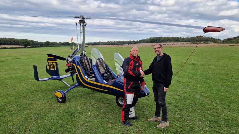 FlyGyrocopter boss Lloyd Carnie, right, with a newly qualified PPL(G)