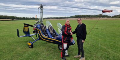 FlyGyrocopter boss Lloyd Carnie, right, with a newly qualified PPL(G)