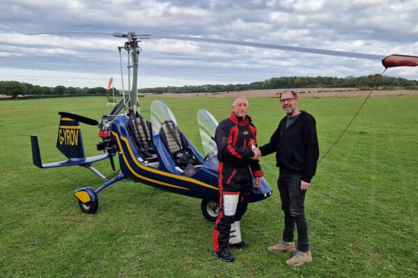 FlyGyrocopter boss Lloyd Carnie, right, with a newly qualified PPL(G)