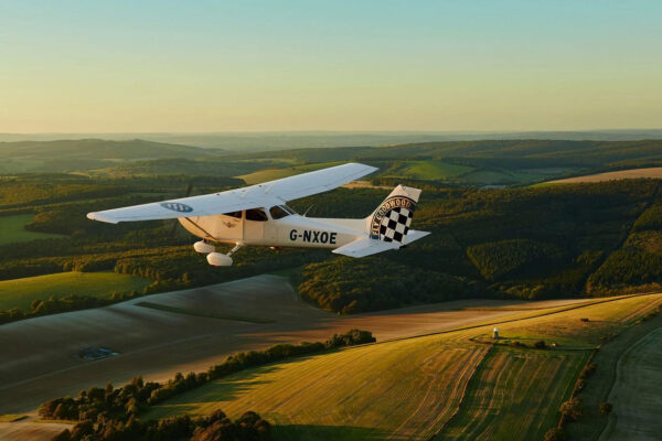 One of Goodwood's Cessnas flying over the Sussex countryside. Photo: Mike Caldwell/Goodwood Flying School