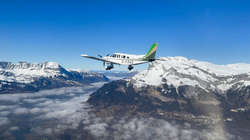 Light aircraft flying over the French Alps.