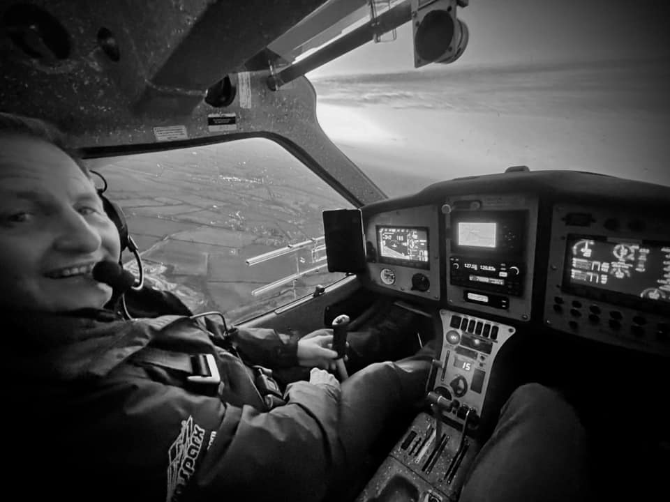 Pilot inside light aircraft.