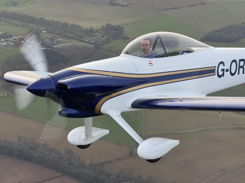 Air to air photo of a small aeroplane.