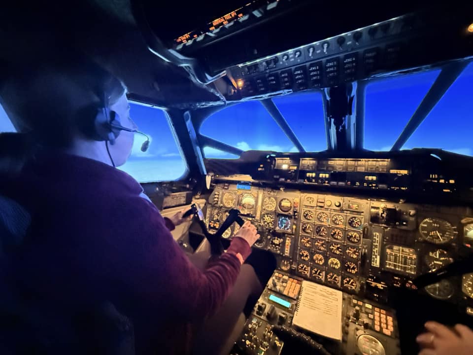 Pilot inside Concorde simulator.