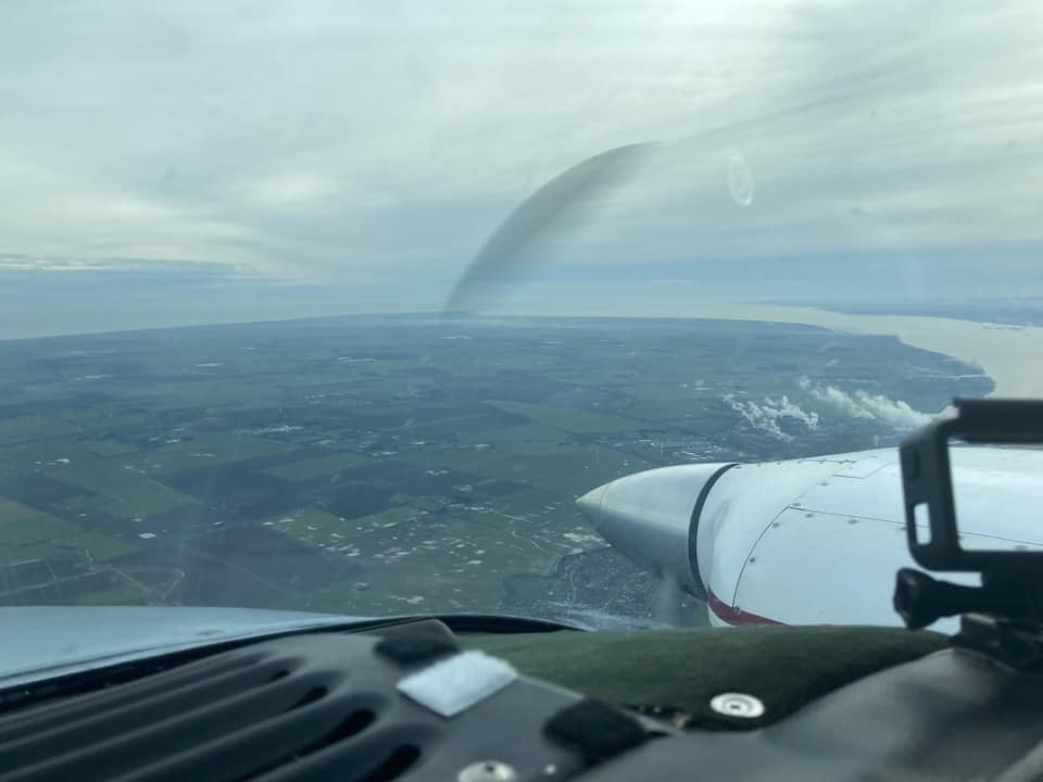 Aerial view from the cockpit of a light aircraft.