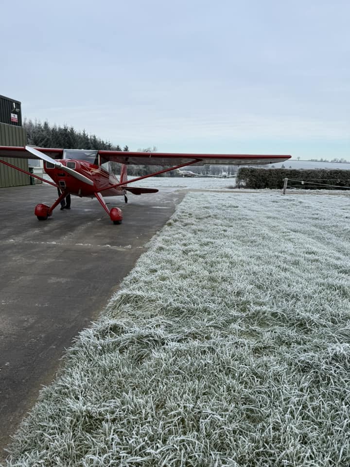 Light aircraft parked on the ground in the frost.