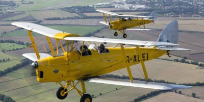 The yellow and silver Tiger Moth biplanes of the Cambridge Flying Group. Photo: CFG/Ben Montgomery
