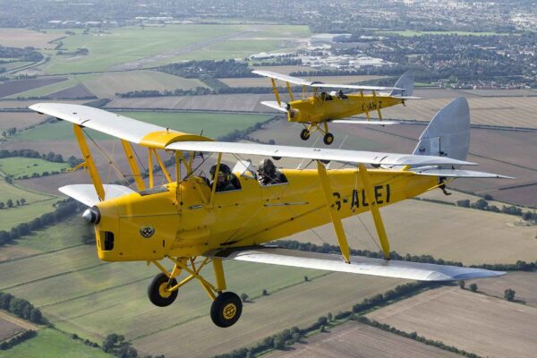 The yellow and silver Tiger Moth biplanes of the Cambridge Flying Group. Photo: CFG/Ben Montgomery