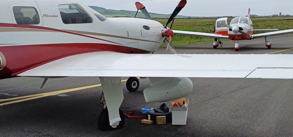 Acting as a flying recovery van to fix a flat tyre.