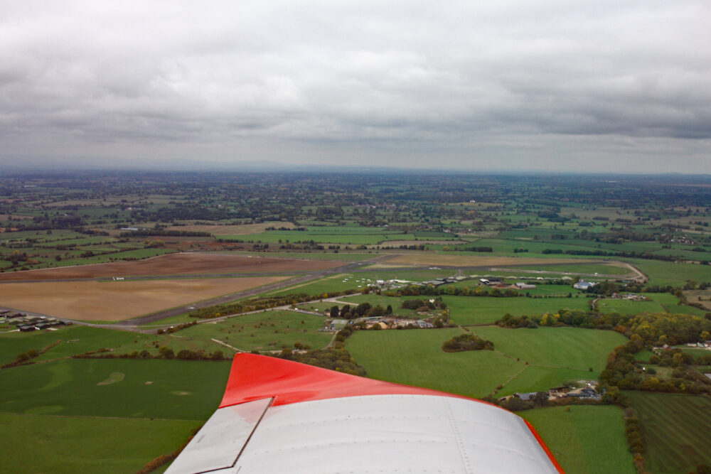 Turning onto the downwind leg for RW18 at Sleap on a dull day.