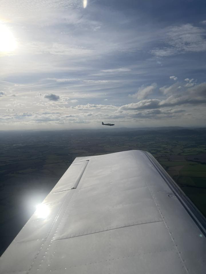 Light aircraft in formation.