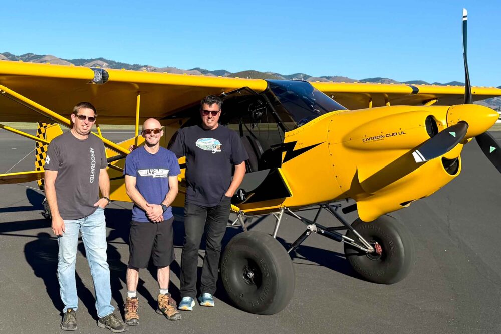 The team behind the record-breaking Carbon Cub UL altitude flight. From left to right: Tres Clements (Aerocrafted — hangar, tools, and ground support), Jon Kotwicki (Fly8MA — pilot), and Paulo Iscold (Professor, Cal Poly San Luis Obispo — project oversight)