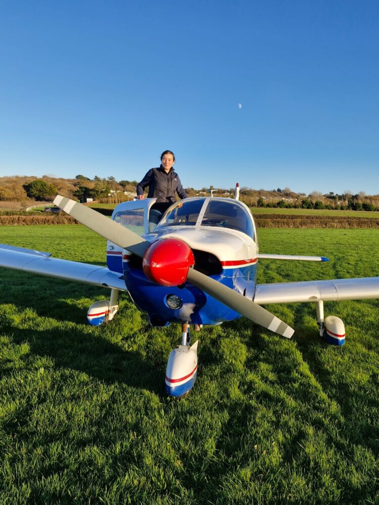 Woman standing on PA28 wing