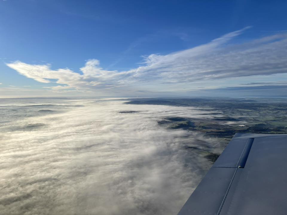 Low clouds over landscape.