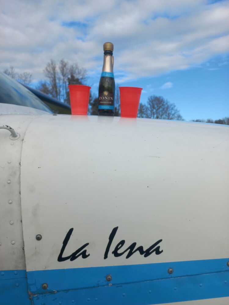 Champagne bottle on aircraft fuselage