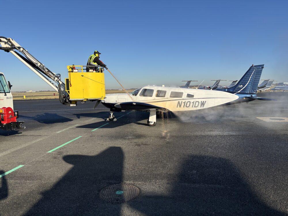 Light aircraft being de-iced