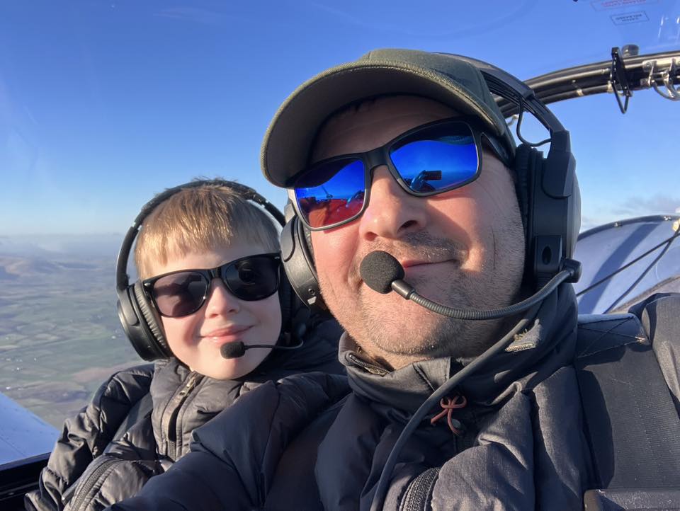 Pilot and son in light aircraft.