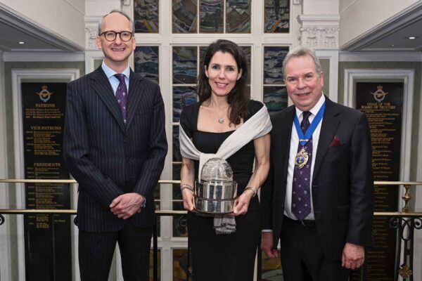 Karen receiving her award from Sebastian Pooley, left, and John Denyer, Master of the Honourable Company of Air Pilots