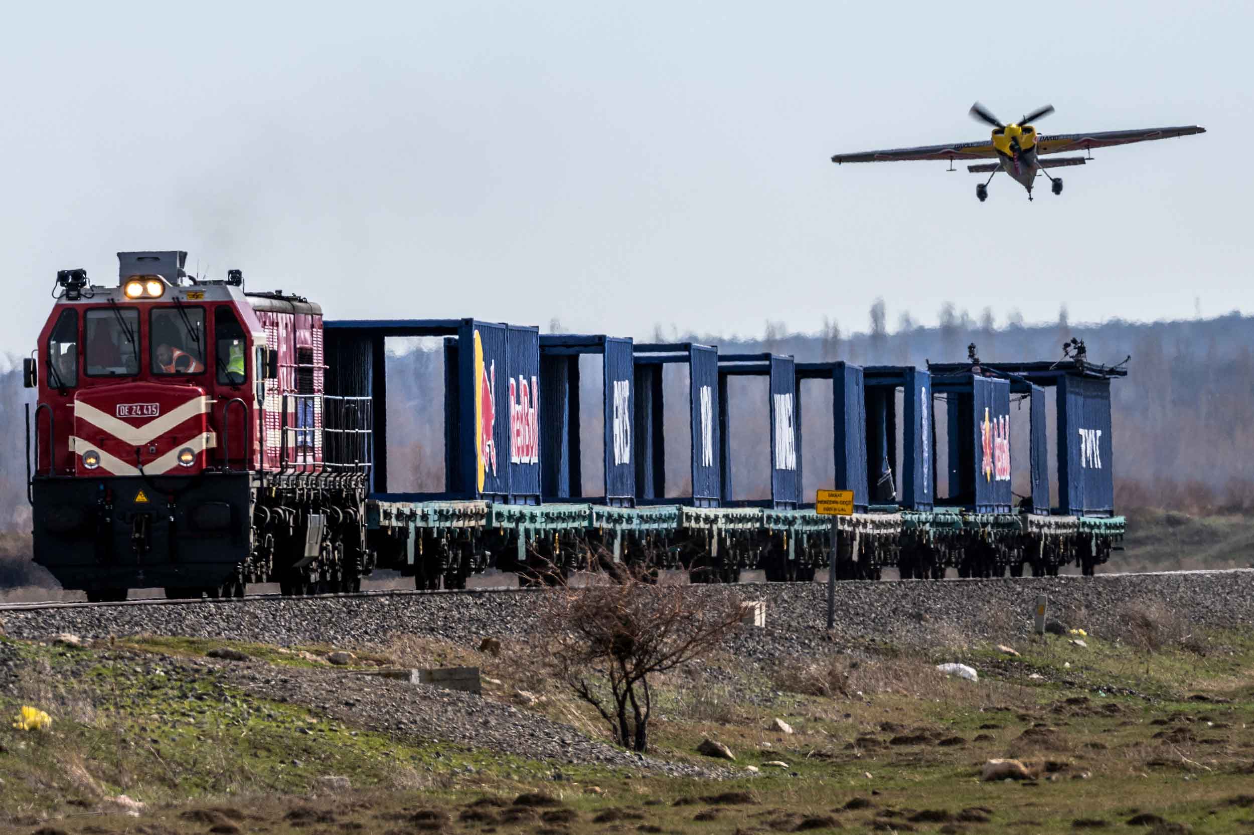 Dario Costa landing on a moving train. Photos: Red Bull