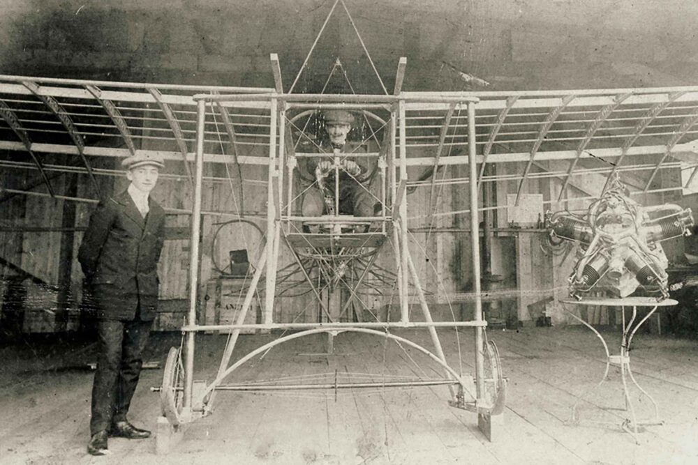 Emile de Schepper standing with Hubert Hagens seated in the aircraft