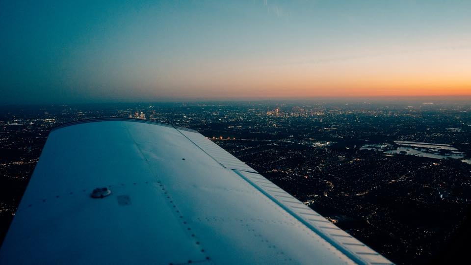 Light aircraft wing at sunset.