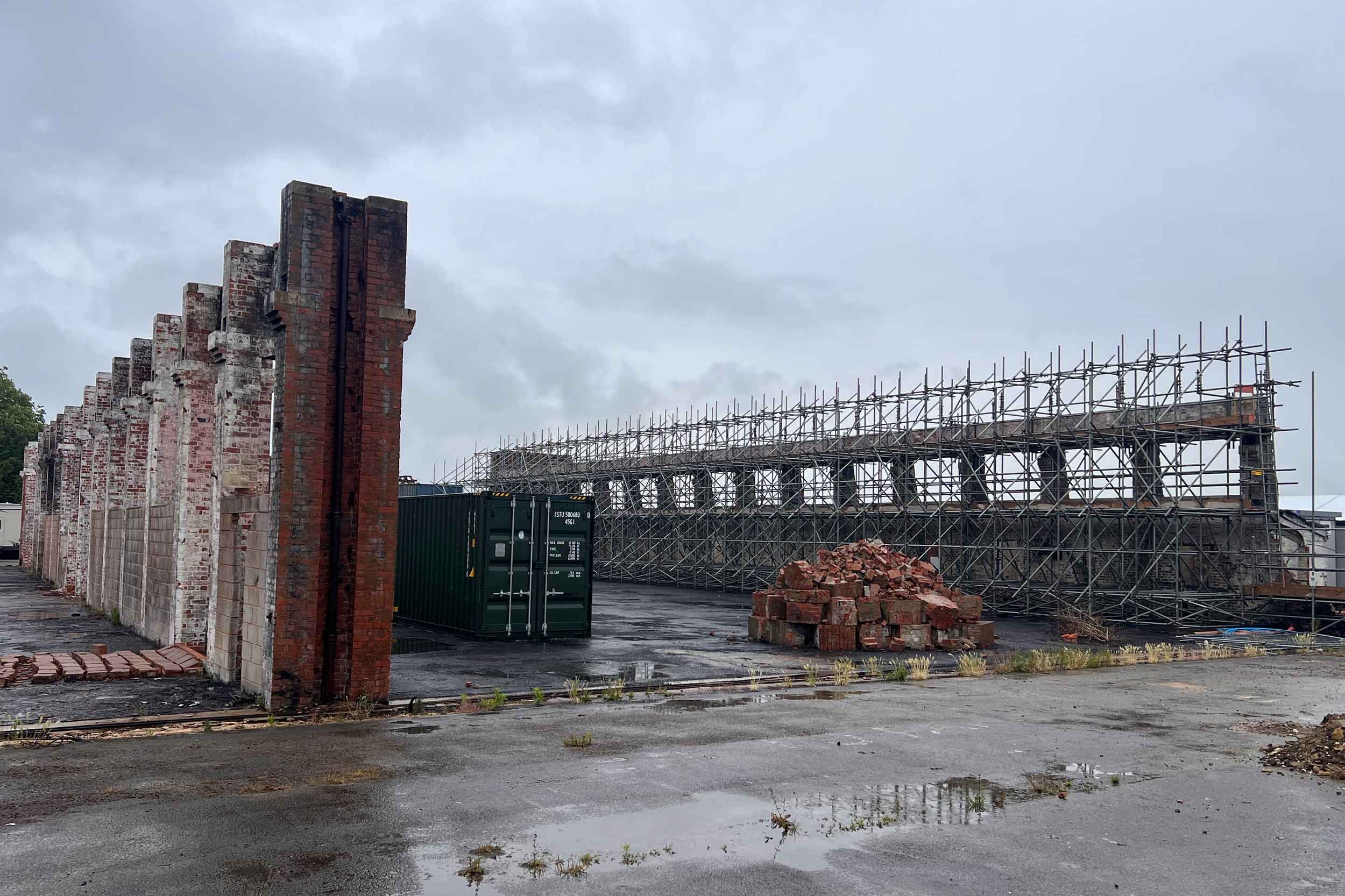 Hangar 3 now, a year after the fire with the site cleared of asbestos, and original bricks being saved for the rebuild