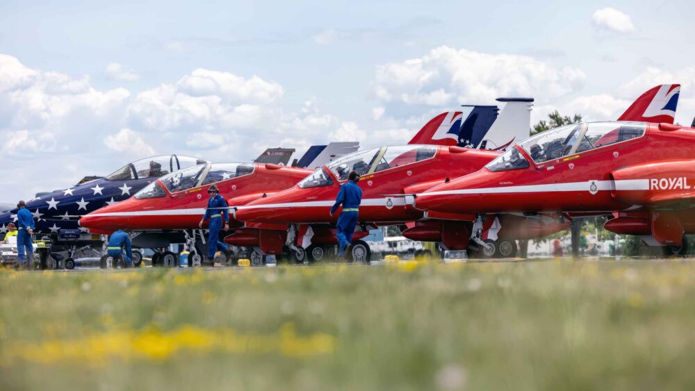 Blue overalled tech team look after the aircraft of the UK's Red Arrows as they appear at Oshkosh for the first time. Photos: RAF